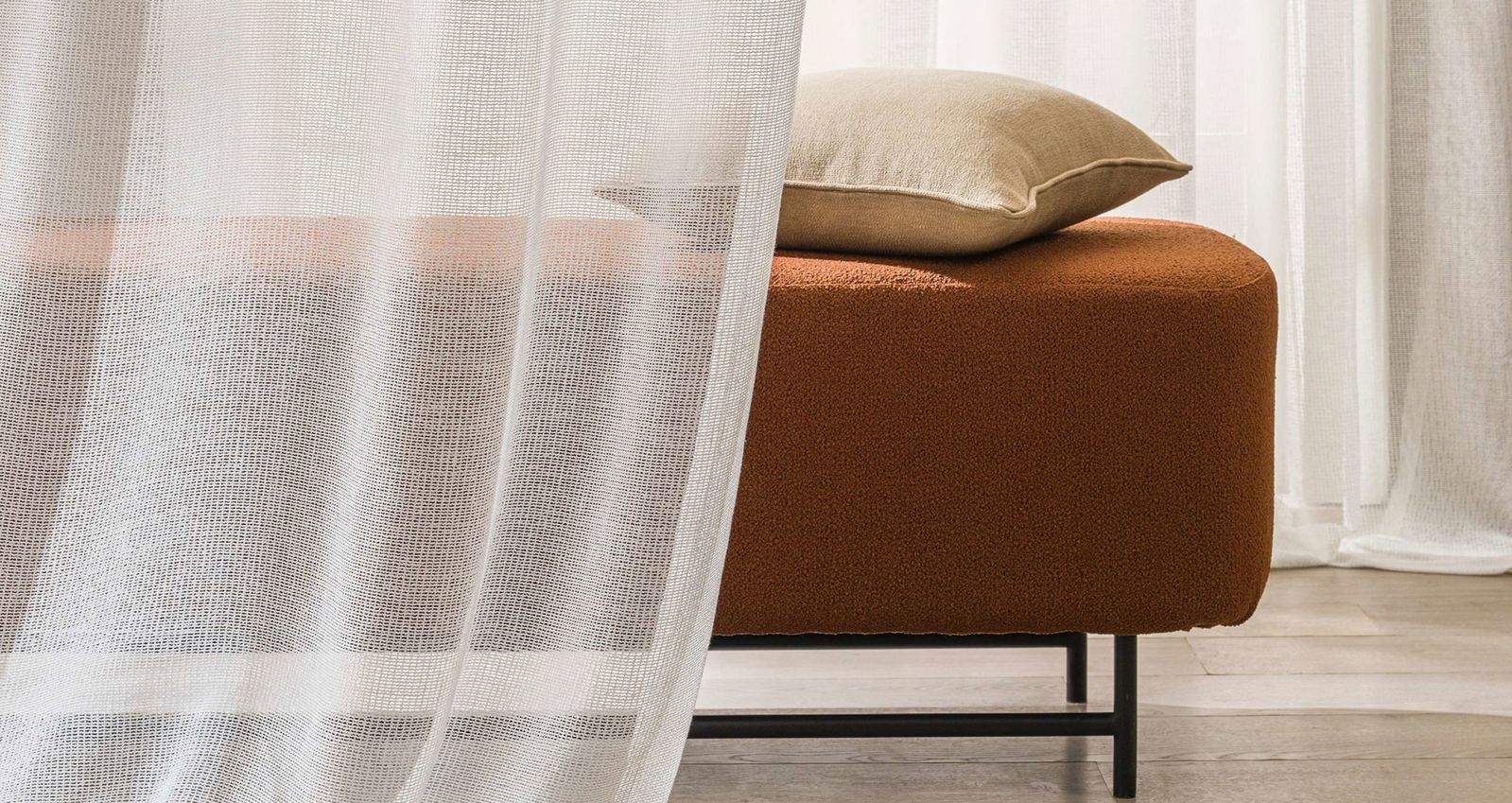 Patterned sheer curtain with a woven grid texture